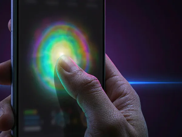 bro444 + Finger touching a glowing circle on a phone screen
